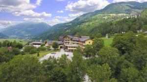 an aerial view of a resort in the mountains at Erlebnishotel Kärnten-Mölltal 3 Stern Superior in Obervellach