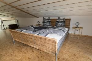 a large bed with pillows on it in a room at Selke´s exklusives Ferienhaus in Clausthal-Zellerfeld