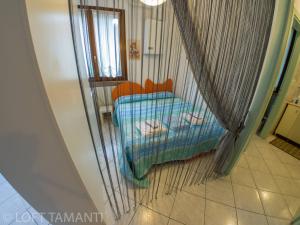 A bed or beds in a room at Loft Tamanti