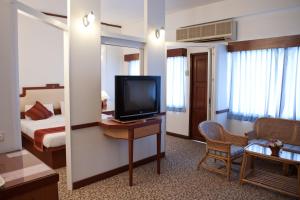 TV a/nebo společenská místnost v ubytování Tanyong Hotel