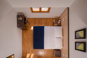 a room with a bed with a flag on it at Apartments Vallum in Bol