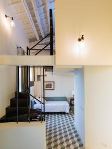 Двухъярусная кровать или двухъярусные кровати в номере Al Foro Annonario