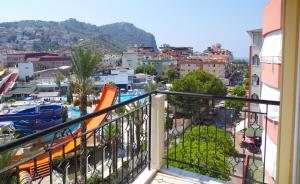 a balcony with a view of a city at Hotel Kleopatra in Alanya