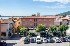 a group of cars parked in a parking lot at Hotel dell'Angelo in Predore