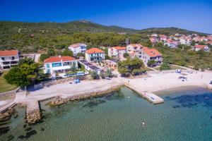 an aerial view of a beach with a resort at Mobile Homes Pine Tree in Dobropoljana