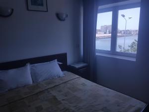 Postel nebo postele na pokoji v ubytování Hotel El Layeli