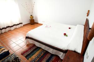 Postel nebo postele na pokoji v ubytování Hostal Mulhacen