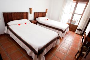 Postel nebo postele na pokoji v ubytování Hostal Mulhacen