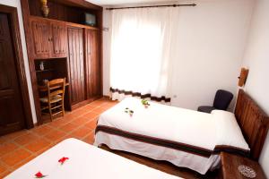 Postel nebo postele na pokoji v ubytování Hostal Mulhacen