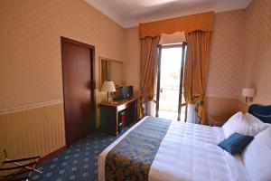 Postel nebo postele na pokoji v ubytování Hotel Cilicia