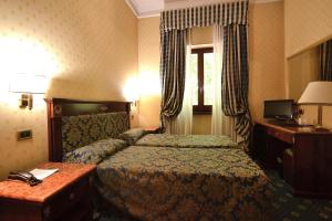 Postel nebo postele na pokoji v ubytování Hotel Cilicia + 22 fotografií