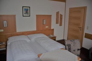 Łóżko lub łóżka w pokoju w obiekcie Pension Appartement Ambrosi