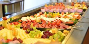 a buffet filled with many different types of fruit at Hotel Royal Palace in Messina