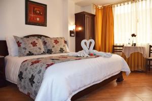 Postel nebo postele na pokoji v ubytování Hotel Plaza Victoria