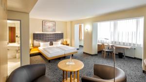 Postel nebo postele na pokoji v ubytování ABACUS Tierpark Hotel