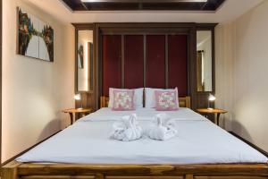 Ένα ή περισσότερα κρεβάτια σε δωμάτιο στο Baanchernchiangmai Hotel