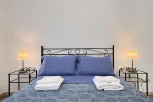 Ein Bett oder Betten in einem Zimmer der Unterkunft Appartamento turistico di Lulù