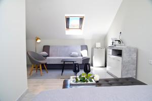 a living room with a couch and a table at Split Center in Split