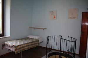 Un ou plusieurs lits dans un hébergement de l'établissement Appartamento Con Cortile