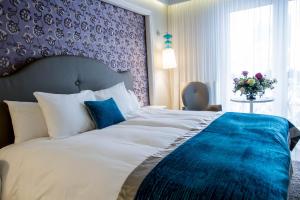 Postelja oz. postelje v sobi nastanitve Hotel Dragului