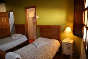 Łóżko lub łóżka w pokoju w obiekcie Casa Rural Ugarte Ojacastro