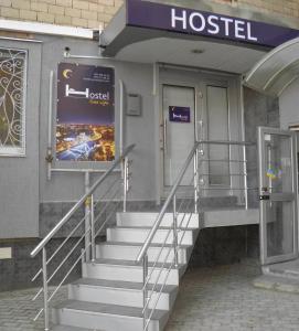 a hospital building with stairs in front of a hospital at Hostel Good Night in Kharkiv