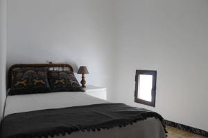 Postel nebo postele na pokoji v ubytování La casita de la ciudad