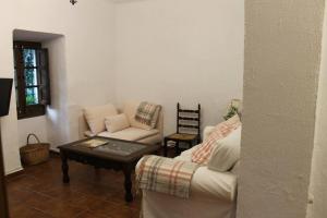 Posezení v ubytování La casita de la ciudad