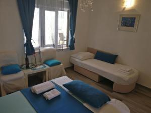 Postel nebo postele na pokoji v ubytování Apartments Veronika
