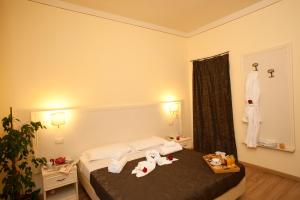 Säng eller sängar i ett rum på Hotel Il Monte