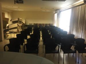 an empty room with chairs and a large window at Apartamento Marina in Rio de Janeiro +61 photos