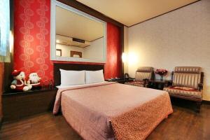 Postel nebo postele na pokoji v ubytování Hotel Lee-Chan