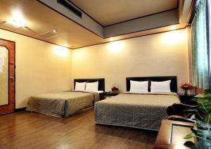 Postel nebo postele na pokoji v ubytování Hotel Lee-Chan