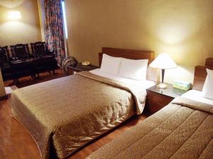 Postel nebo postele na pokoji v ubytování Hotel Lee-Chan