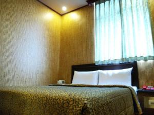 Postel nebo postele na pokoji v ubytování Hotel Lee-Chan