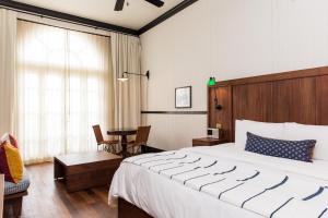 Postel nebo postele na pokoji v ubytování American Trade Hotel