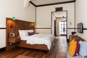 Postel nebo postele na pokoji v ubytování American Trade Hotel