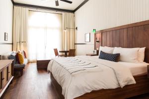 Postel nebo postele na pokoji v ubytování American Trade Hotel