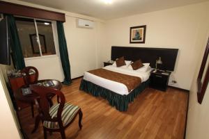 Postel nebo postele na pokoji v ubytování Hotel San Fernando Real