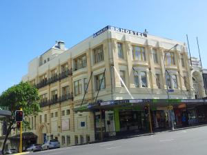 a building on the corner of a city street at BK Hostel in Auckland