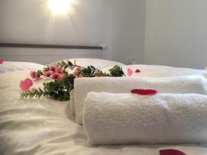 A bed or beds in a room at Saint Michael - Garni Hotel