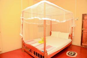 Rúm í herbergi á Natural Cabanas