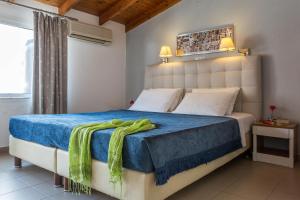 Postel nebo postele na pokoji v ubytování Hotel Akti