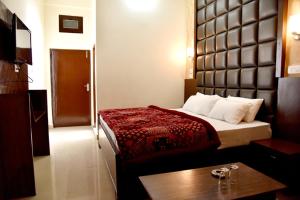 Postel nebo postele na pokoji v ubytování Hotel Ram