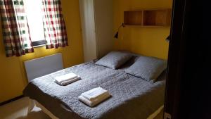 Lova arba lovos apgyvendinimo įstaigoje Sälens Bed & Breakfast Apartments