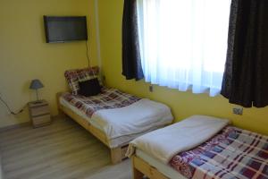 Postel nebo postele na pokoji v ubytování Fortuna