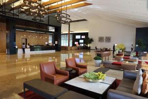 a lobby of a hotel with chairs and a table at Midori Clark Hotel and Casino in Clark