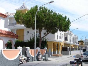 a group of motorcycles parked in front of a building at Apartment in Rota Cadiz, Air Cond, Wifi, Patio in Rota