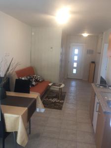 a living room with a couch and a table at Apartment Buic in Pula