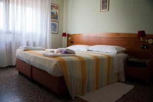 Postel nebo postele na pokoji v ubytování Hotel Trieste